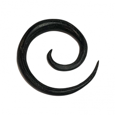 Spiral-shaped piercing in areng wood.