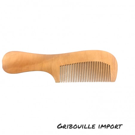 Peigne écologique artisanal en bois avec un manche.