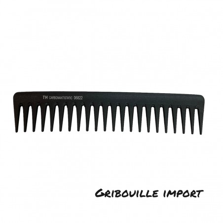 Large-toothed plastic comb.